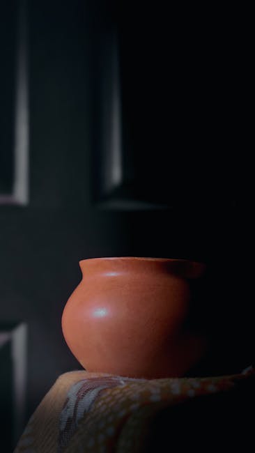 Handcrafted clay pot representing organic nutrition and raw ingredients